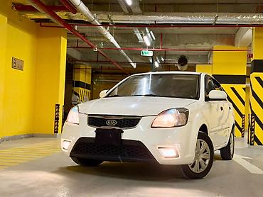 avtomobil az zil 130: Kia Rio: 1.4 л | 2010 г. Седан — 1
