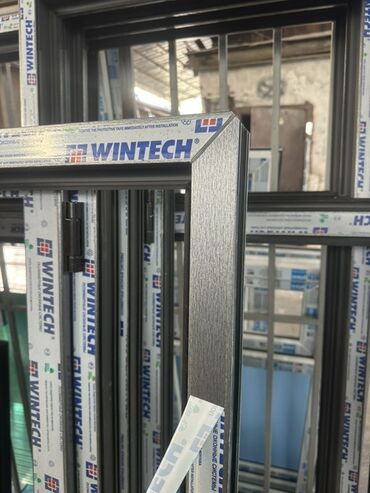 металлическая труба: ПВХ-окна WINTECH, тёмный ламинированный профиль Описание: -