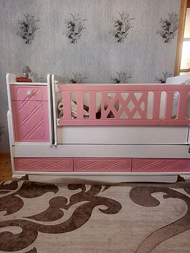 Beşiklər: Uşaq beşiyi – “Melek Bebe” modellidir. Ağ-çəhrayı rəng çaları ilə — 3