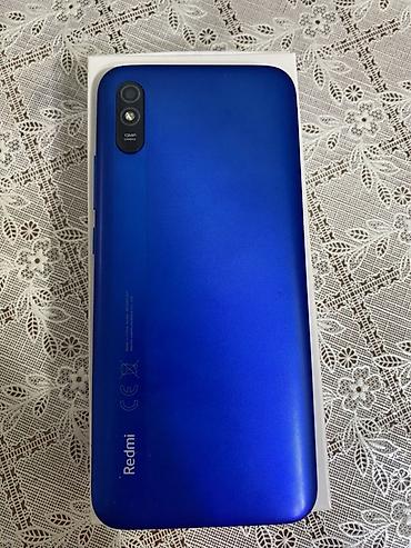 pixel 9a: Xiaomi Redmi (mavi rəng) - Ekran: təxminən 6” tam ekran, ön kamera — 2