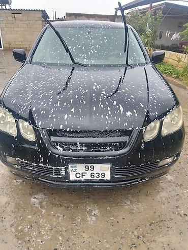 misin: Mitsubishi universal kuzovlu minik avtomobil. Qara rəngdə olan bu — 4
