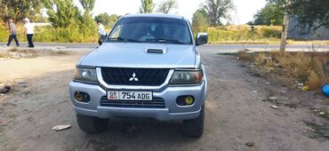 тюнинг выхлопной системы: Mitsubishi Pajero Sport I (рестайлинг), серебристый внедорожник