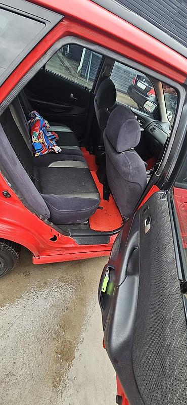 Mazda: Mazda Familia: 2001 г., 2 л, Автомат, Бензин, Универсал — 10