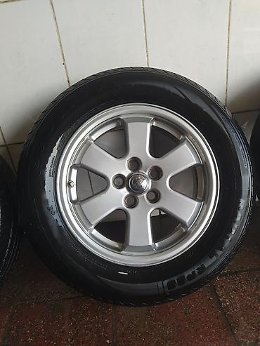 islenmis teker satisi: 4 ədəd yığılmış disk+şin komplekti əla vəziyyətdədiler pirus diskidi — 2