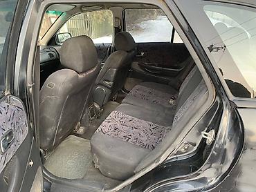 Mazda: Mazda 323: 2000 г., 1.8 л, Механика, Бензин, Универсал — 9