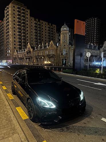 mersedes guzgu: Mercedes-Benz E‑Class sedan – AMG paketli, qara rəngdə. Əsas — 10
