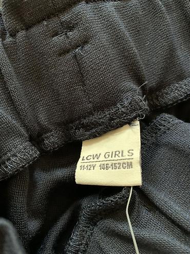 футболка: LCW Girls markalı qız uşaq şalvarı. Tünd göy rəngdədir, geniş balaqlı — 2