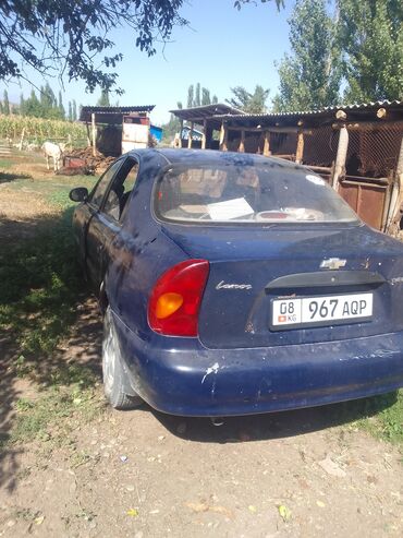 шевроле камаро цена: Автомобиль Chevrolet Lanos синего цвета. На задней части кузова