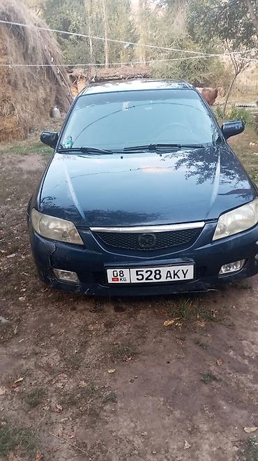 subaru legaci: Mazda 323: 2002 г., Универсал — 1