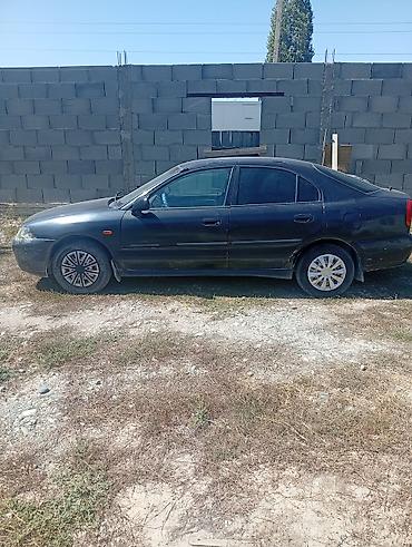 руль windom: Mitsubishi Carisma: 1999 г., Седан — 6