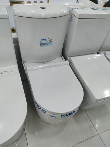 купить унитаз с бачком недорого: Ağ rəngli, kompakt dizaynlı unitaz. Ev və ya ticarət məkanları üçün