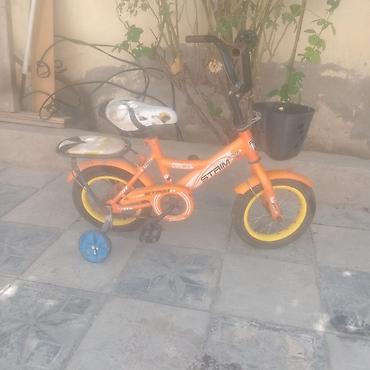 Спорт и хобби: Uşaq velosipedi – Strim marka, kiçik ölçü - Rəng: narıncı gövdə, sarı — 1