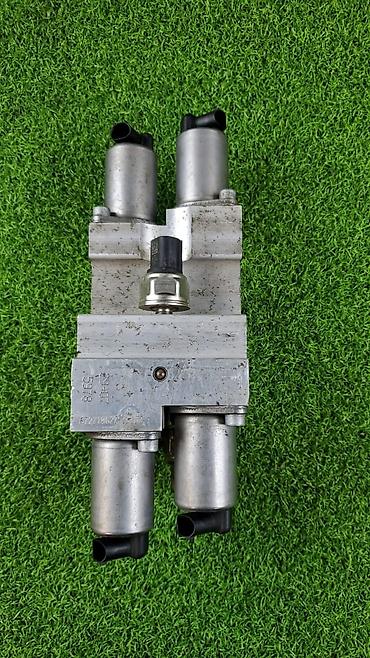 Другие автозапчасти: Блок клапанов гидроподвески (Dynamik Drive) для БМВ X5 Е70 ​6782—737 — 7