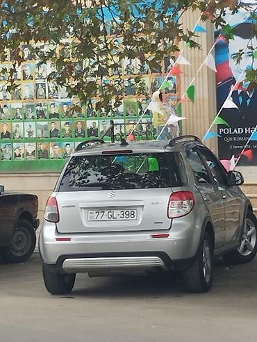 suzuki moto: Suzuki SX4 – gümüşü rəngli, şəhər və rayon yolları üçün praktik — 7