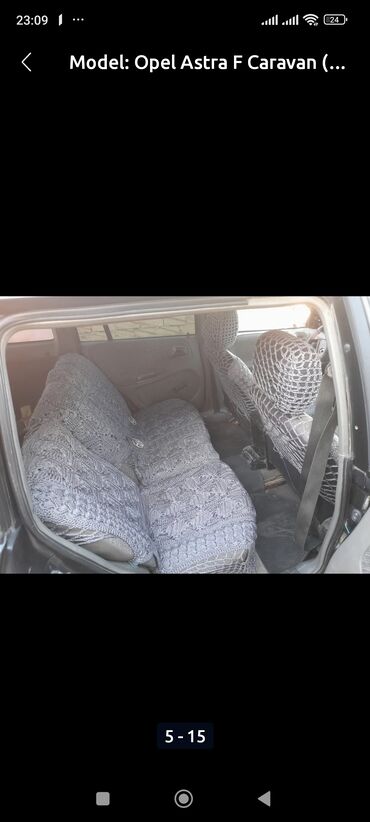 Opel: Opel Astra Caravan – universal kuzovlu, qara rəngdə. Əsas — 2