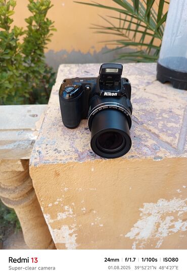 notebook en ucuz: Nikon brendinə məxsus qara rəngli fotoaparat, istifadəçilər üçün rahat
