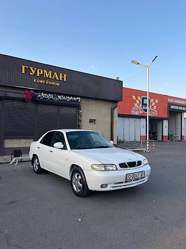Транспорт: Daewoo Nubira: 1997 г., Бензин, Седан — 2