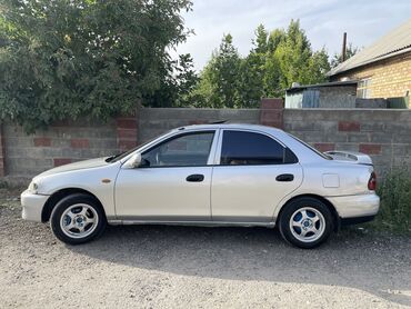 corolla runx: Mazda 323: 1995 г., 1.5 л, Механика, Бензин, Седан