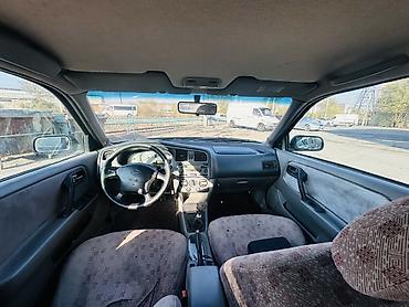 mazda 323 2003: Nissan Primera: 2001 г., 1.8 л, Механика, Бензин, Универсал — 5