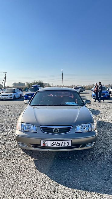 футляр для кия: Mazda Capella: 2001 г., 2 л, Автомат, Бензин, Седан — 2