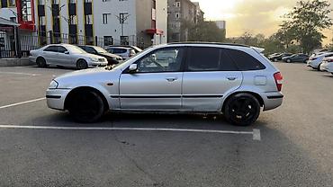 bmb e36: Mazda 323: 1999 г., 1.6 л, Механика, Бензин, Универсал — 8