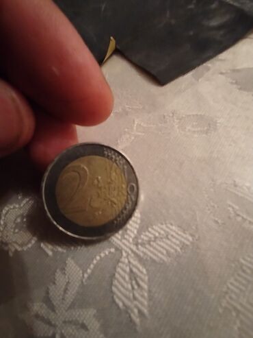 1 sent nece manatdir: Məhsul: 2 avro sikkəsi – Almaniya Təsvir: - Nominal: 2 EUR - Ölkə