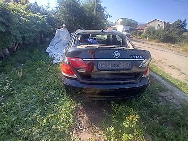 e53 amg: BMW 7 Series 740Li, чёрный седан (длинная база). На фото — автомобиль — 3