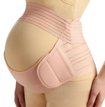 женщины в корсетах: Польза от ношения бандажа во время беременности состоит в том, что
