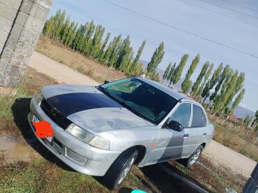 Транспорт: Mitsubishi Lancer: 1998 г., 1.3 л, Механика, Бензин, Седан