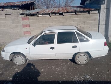 опель фронтера б: Белый седан Daewoo Nexia с тонированными задними стеклами. Модель