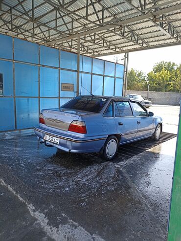 двигатель на нексии: Daewoo Nexia, седан, голубой цвет кузова. Бензиновый двигатель DOHC