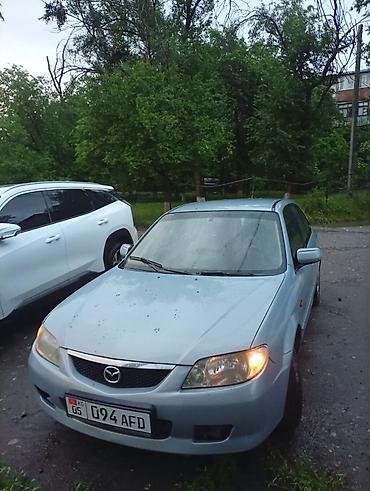 mers e210: Mazda 323: 2002 г., Механика, Хэтчбэк — 2