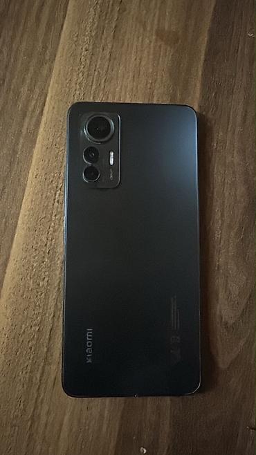 телефон fly nimbus 1: Xiaomi 12, цвет - Черный, 
 Отпечаток пальца — 1