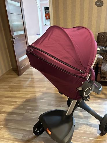 baş ortusu: Uşaq arabası – Stokke Xplory (bənövşəyi rəng) Xüsusiyyətlər: - Yüksək — 2