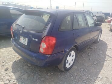 новые шины: Mazda 323: 2003 г., 1.6 л, Механика, Бензин, Хетчбек