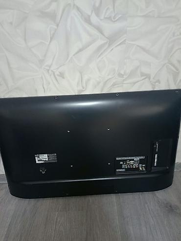 tv stick: LG LED televizor, təxminən 42–47 düym ekran ölçüsü. Nazik gümüş — 3