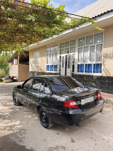 машына приора: Черный седан Daewoo Nexia (поколение N150). Российские номера