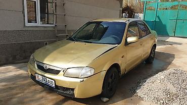 шит приборы: Mazda 323: 1998 г., 1.6 л, Механика, Бензин, Седан — 4
