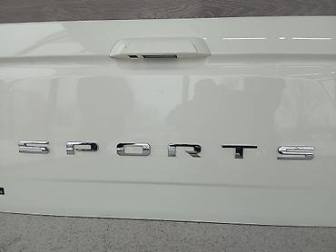 спорт рекстон: Крышка/дверь заднего борта пикапа SsangYong Rexton Sports (эмблема — 2