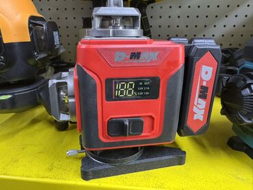 нивелир оптический: Ротационный лазерный уровень D-MAX в прочном красно-черном корпусе