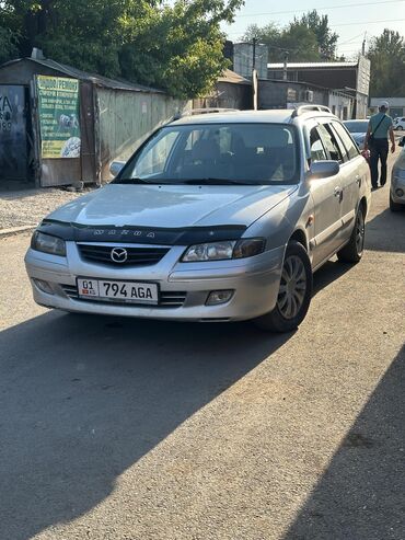 клей для авто: Mazda 626: 2000 г., 2 л, Механика, Бензин, Универсал