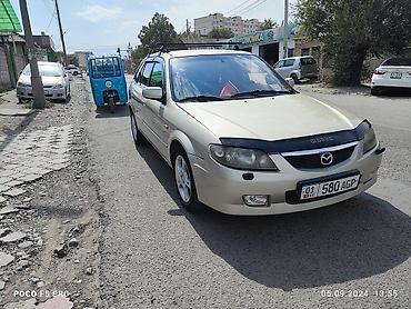 шторка фит: Mazda 323: 2003 г., 1.6 л, Механика, Бензин, Универсал — 1