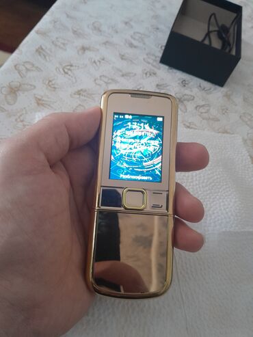 Digər mobil telefonlar: Qızılı korpuslu sürüşdürmə mexanizmalı düyməli mobil telefon — 5