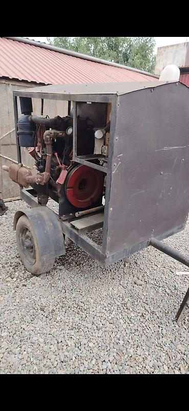 T25 matornan 8 kilovatdiq Generator 3 faza telejkanin belində saz