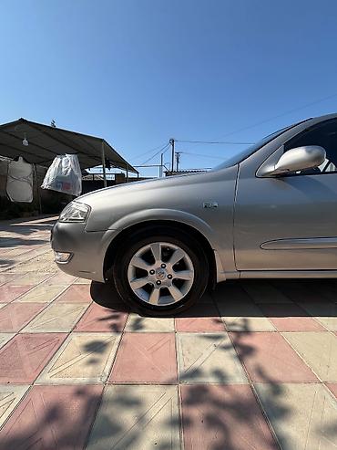 masin cip: Nissan Sunny: 1.6 l | 2008 il Sedan — 5