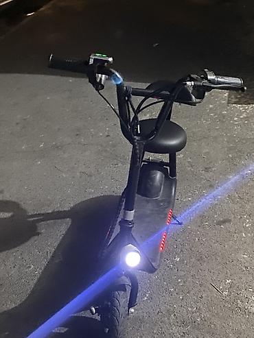 Электротранспорт: Oturacaqlı elektrik skuter -saatda 20 km surerle hereket edir — 2