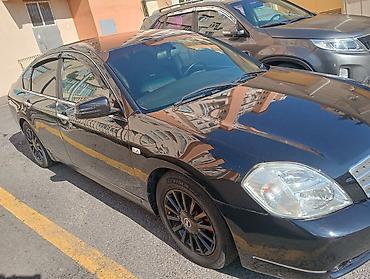 Транспорт: Nissan Teana – qara rəngli, geniş və komfortlu sedan. Xüsusiyyətlər — 2