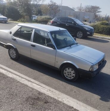 Tofas: Tofaş Şahin/Doğan (sedan) – gümüşü rəng Xüsusiyyətlər: - Kuzov: 4 — 10