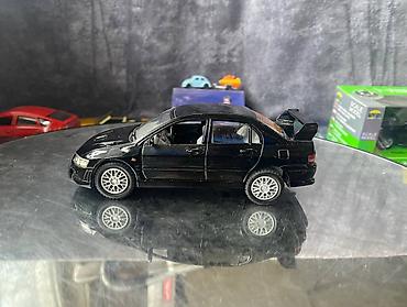 Avtomobil modelləri: Коллекционная модель Mitsubishi Lancer Evolution VII black 2002 — 2