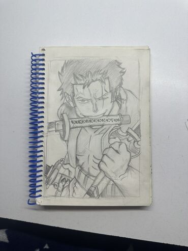 tibb bacisi sekilleri: Roronoa Zoro. Anime. Qələmlə çəkilmiş anime eskizi olan spiral dəftər